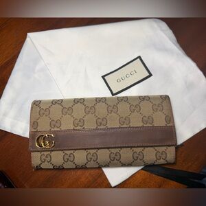 Gucci Brown Mono Long Wallet with dust bag and certificate of authenticity.